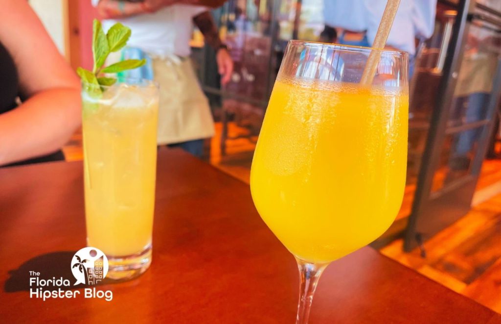 Dole Whip Mimosa at Wine Bar George in Disney Springs in Orlando, Florida. Keep reading for more on the best restaurants in Orlando, Florida. 