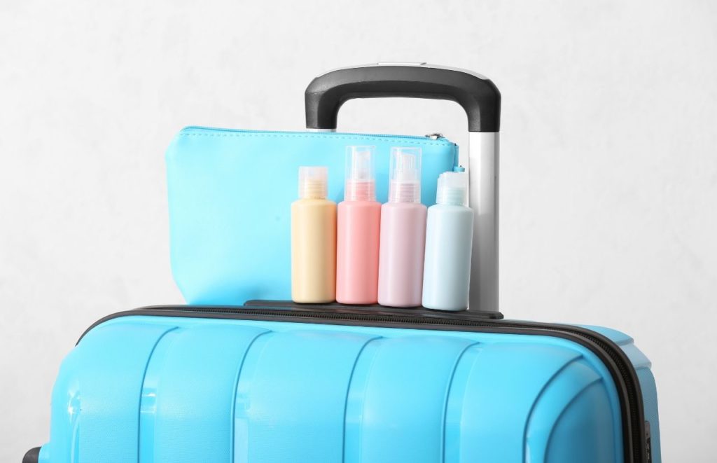 Can carry-on a shaving razor blue travel luggage with toiletries on the top