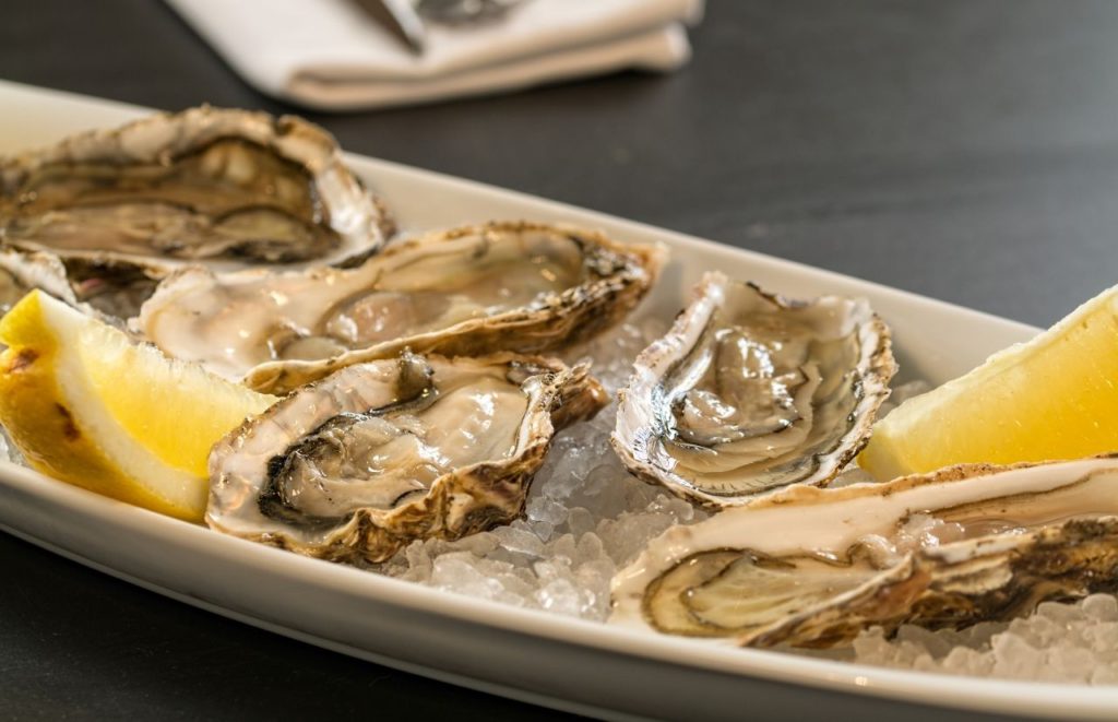 Best Oysters in Orlando Lee and Rick's shucked and on ice with lemon. Keep reading to discover all you need to know about the best oysters in Orlando.  