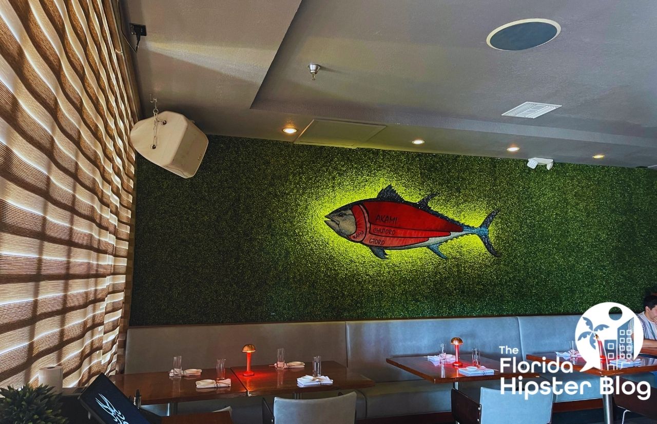 Kabooki Sushi Orlando wall decor with giant fish lit up on the wall. Keep reading to get the full guide on romantic getaways in Orlando.