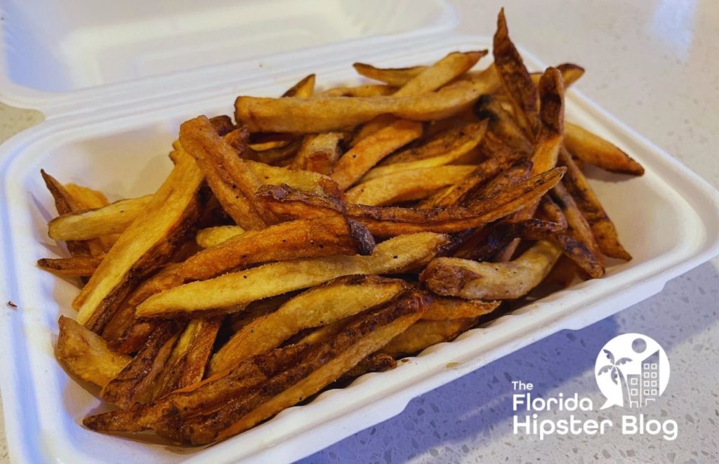 Container of freshly made French fries. Keep reading to find out where are the best places for lunch in Gainesville.