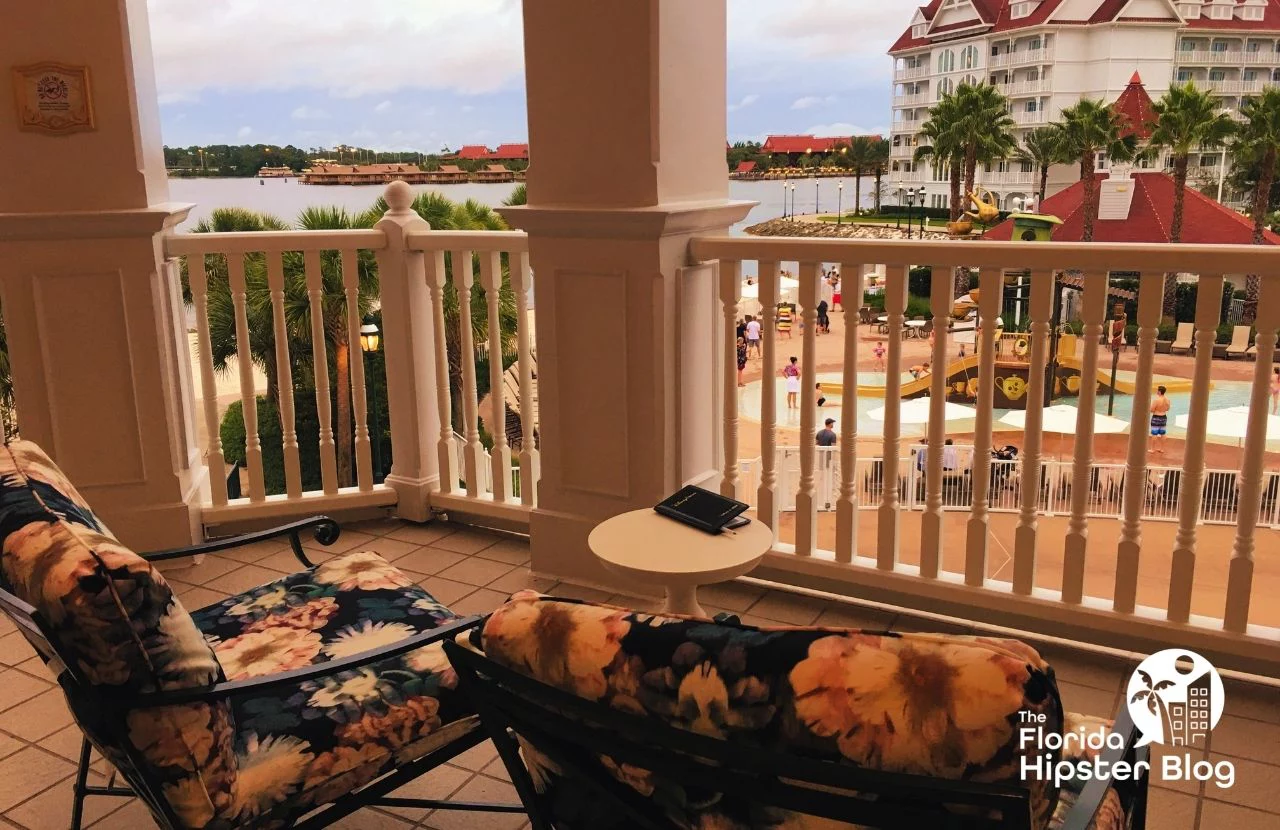 Floral deck chairs overlook the pool area at the Enchanted Rose Lounge at Disney's Grand Floridian Resort & Spa in Orlando, Florida. Keep reading for more romantic getaways in Orlando.