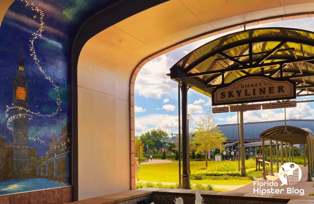A mural is painted at the entrance to the Disney Skyliner at Disney's Riviera Resort in Orlando, Florida. Keep reading for more options for where to stay in Orlando, Florida.
