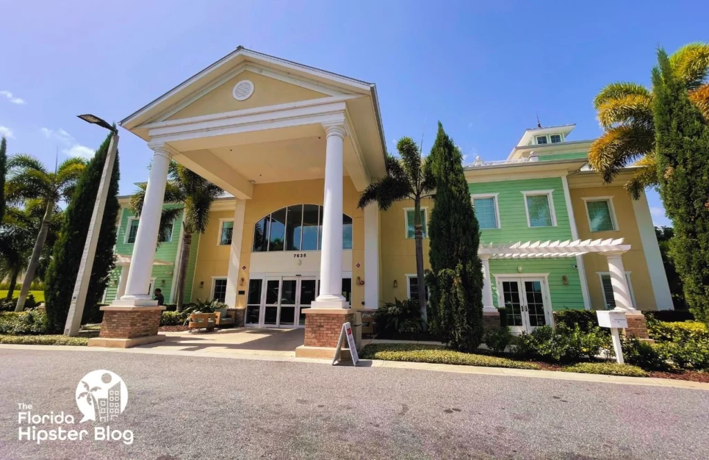 The exterior of the Encore Resort at Reunion in Orlando, Florida. The building is yellow and green with large columns out front. Keep reading for more options for where to stay in Orlando, Florida.