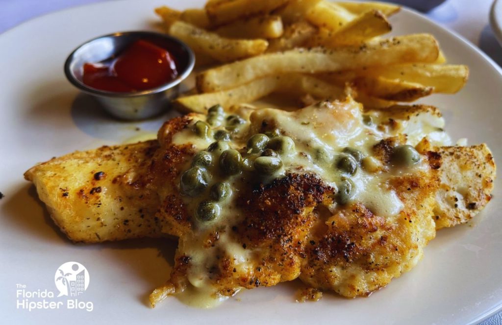 Bonefish Grill Restaurant White Fish topped with caper sauce and fries. Keep reading to learn more about where to go for the best steak in Orlando.