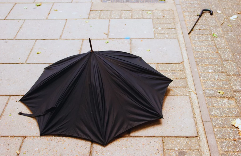 Broken black umbrella. Can I bring umbrella on plane? Keep reading to learn how.