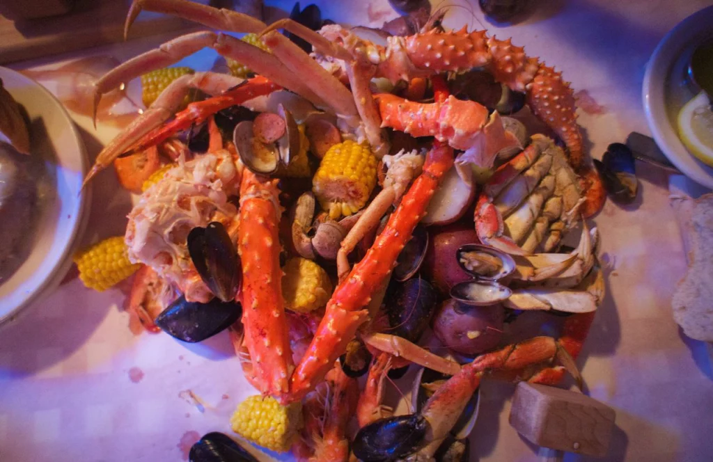 The country boil at Crafty Crab in Orlando, Florida includes crab legs and corn. Keep reading for more places to get the best crab legs in Orlando, Florida.