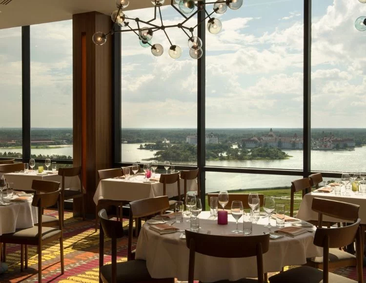Tables at California Grill overlook the water in Orlando, Florida. Keep reading for more on the best restaurants in Orlando, Florida.