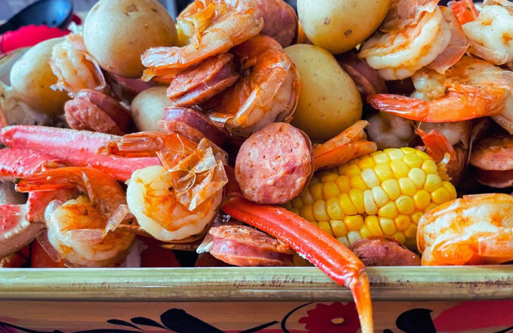 Crab legs, shrimp, potatoes, and corn at EZ Crab Shack in Orlando, Florida. Keep reading for more places to get the best crab legs in Orlando, Florida. 