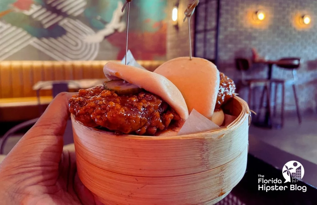 Hawkers Asian Street Food Restaurant in Orlando, Florida Fried Korean Chicken in Bao Buns. Keep reading to get the best lunch in Orlando!