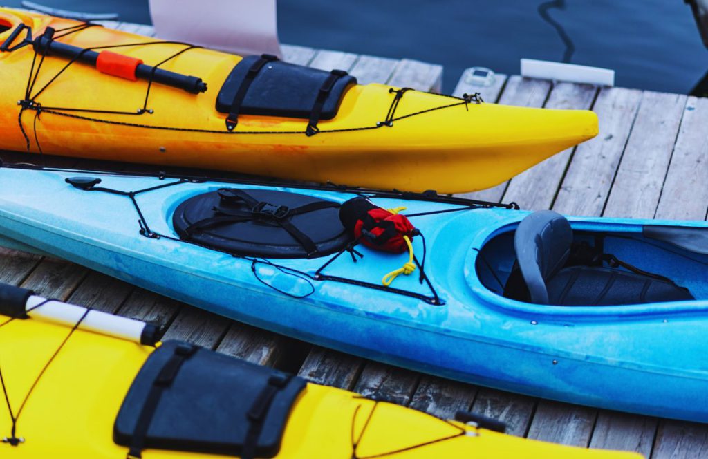 Kayaks lined up on the dock. Keep reading to learn more about things to do in Orlando at night.