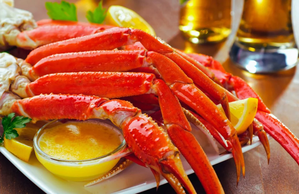 Crab legs and butter at King Cajun Crawfish in Orlando, Florida. Keep reading for more places to get the best crab legs in Orlando, Florida.