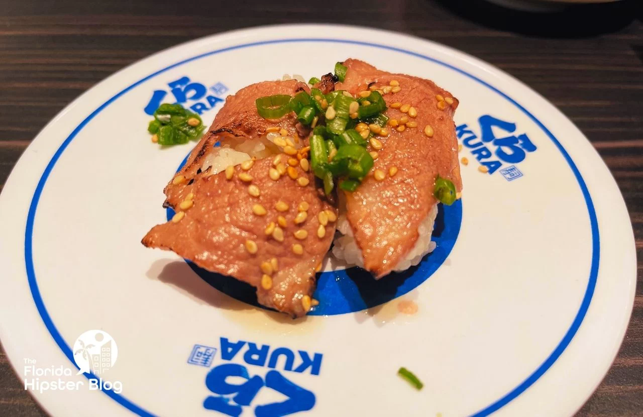Kura Revolving Sushi Bar Restaurant in Orlando, Florida. Keep reading to get the best lunch in Orlando!