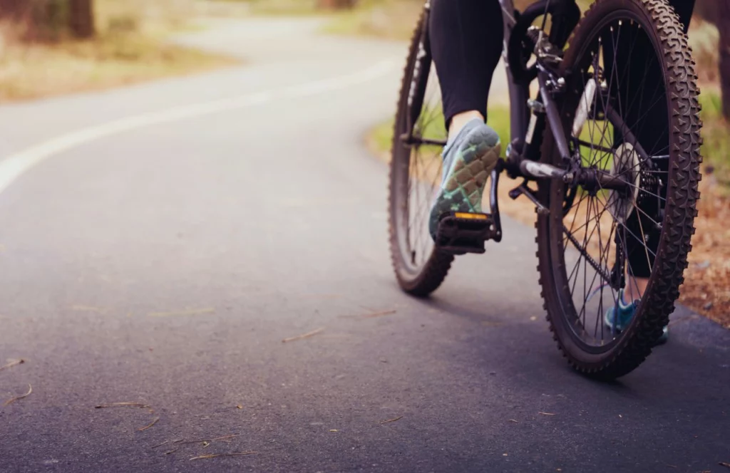 Paved bike trail with bike on it. Keep reading to discover the best gardens in Orlando. 