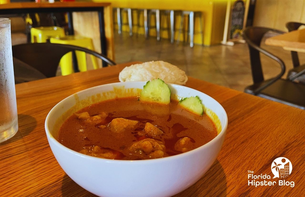 Mamak Asian Street Food Restaurant in Orlando, Florida Chicken Kari with White Rice. Keep reading to get the best lunch in Orlando!