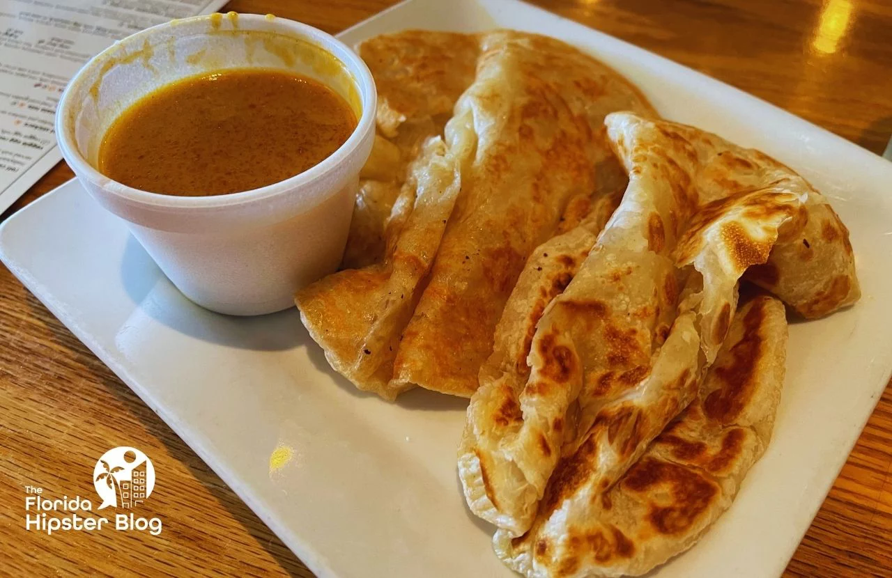Mamak Asian Street Food Restaurant in Orlando, Florida roti bread and sauce. Keep reading to get the best lunch in Orlando!