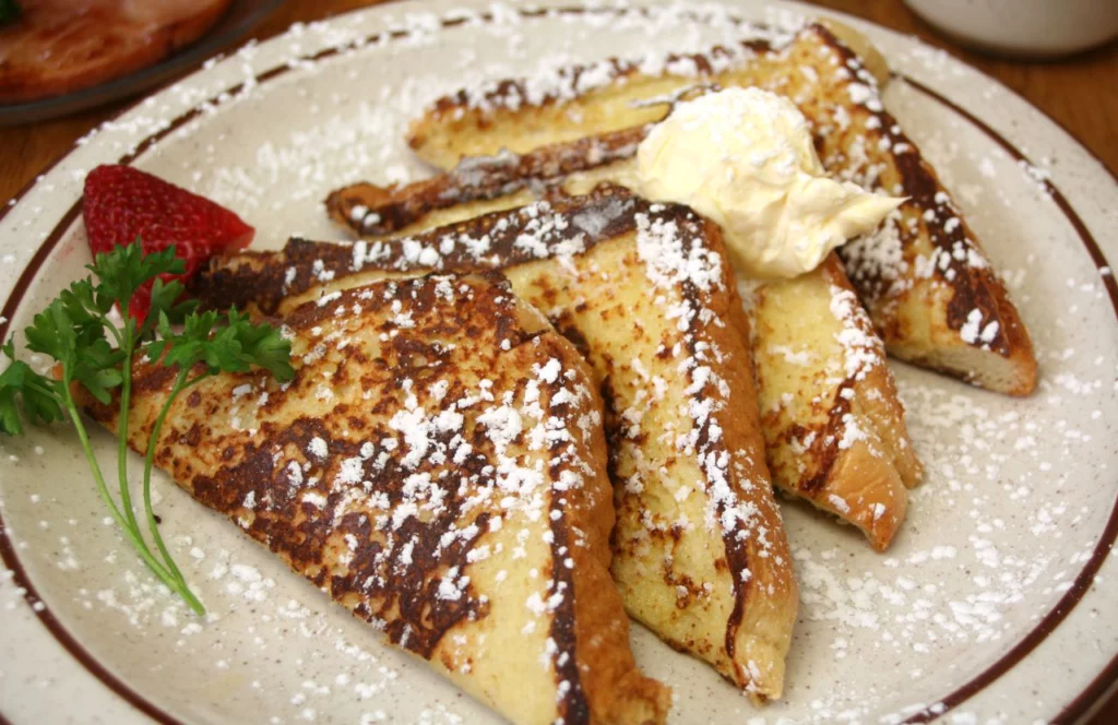 Rodeo Diner Kissimmee Florida French Toast with butter and powdered sugar on top. Keep reading for more places to get the best breakfast in Kissimmee, Florida