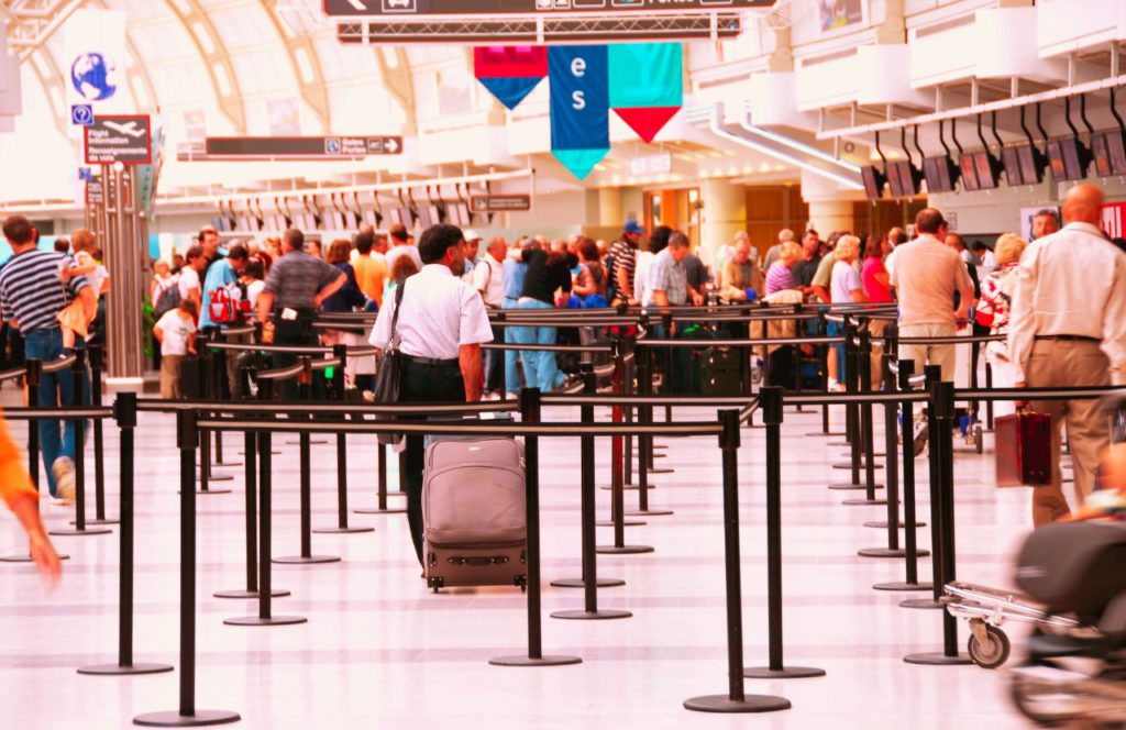 TSA check point. Can I bring umbrella on plane? Keep reading to learn how.