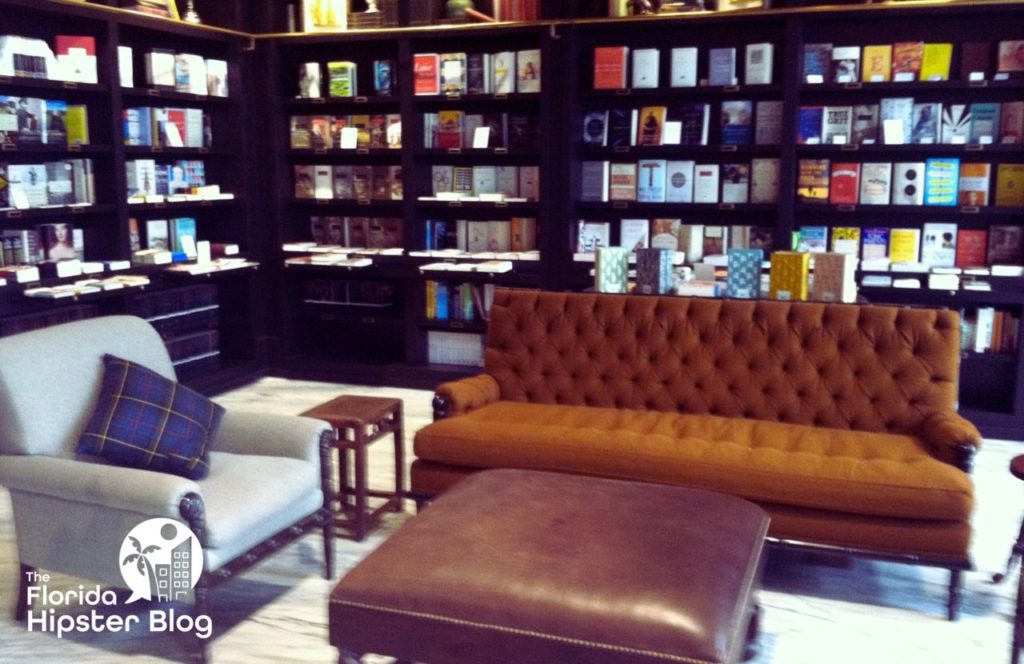 Things to do in Tampa Bay, Florida Oxford Exchange Coffee and Tea Shop. Cozy sitting area and couch with bookshelves all behind. Keep reading to find out more about Tampa coffee. 