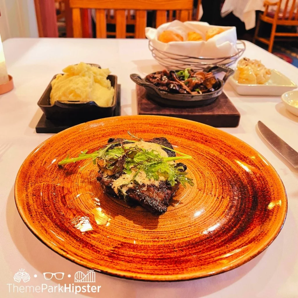 Tasting steak with mashed potatoes and mushroom at steakhouse in Tampa, Florida