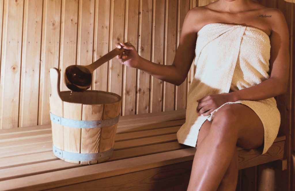 Black lady in the Sauna at Spa Evangeline. Keep reading to find out all you need to know about day spas in Tampa. 