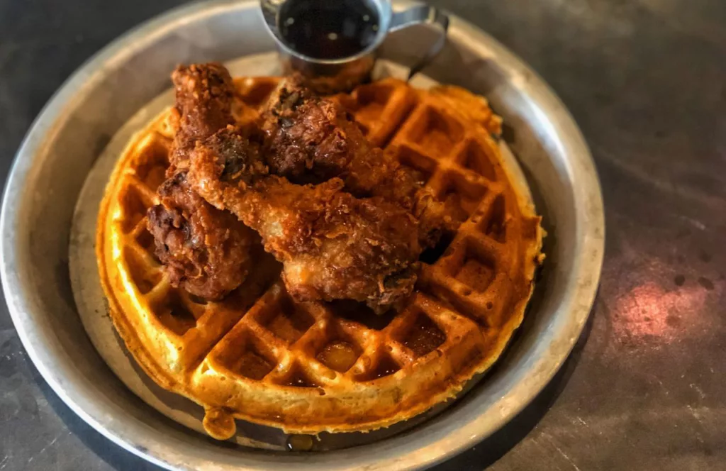 Chicken and Waffles with syrup. Keep reading to find out more about where to find the best brunch in Gainesville. 