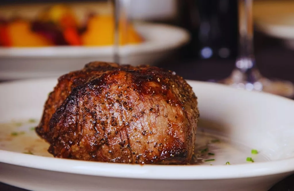 Filet Mignon on White Plate at Ocean Prime This a best steakhouse in Tampa, Florida and one of the best places to get steak.