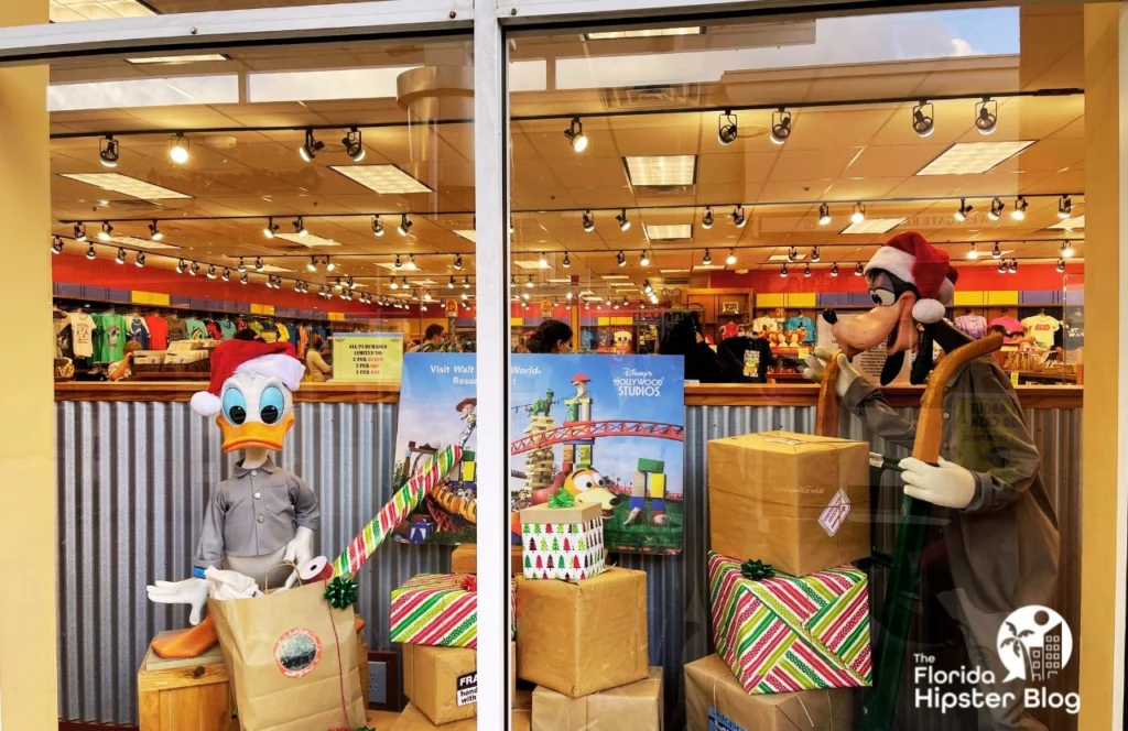 Disney Character Warehouse Store at Christmas with Donald Duck and Goofy in the window. Keep reading to find out all you need to know about the best Florida Christmas gift ideas. 
