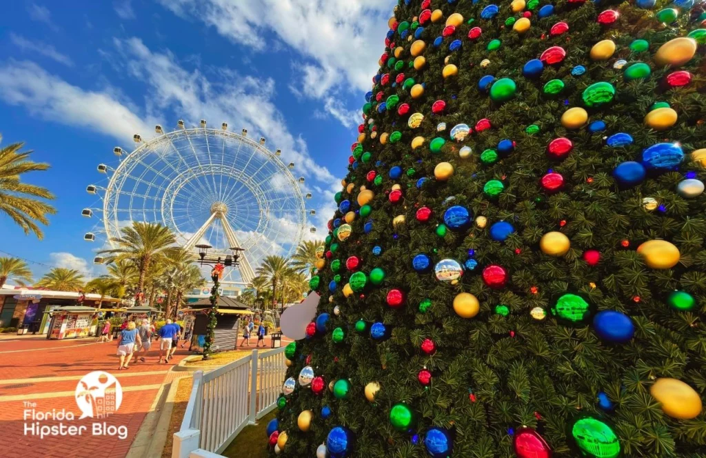 ICON Park Christmas Tree on International Drive. One of the best things to do in Orlando for Christmas. Keep reading to get the best Orlando Christmas Lights locations.