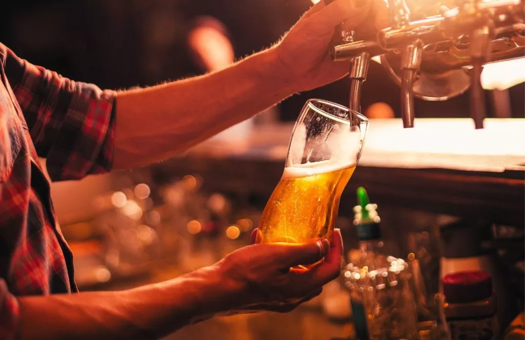 Pint of beer being poured from the tap. Keep reading to discover more about Jacksonville nightlife.  