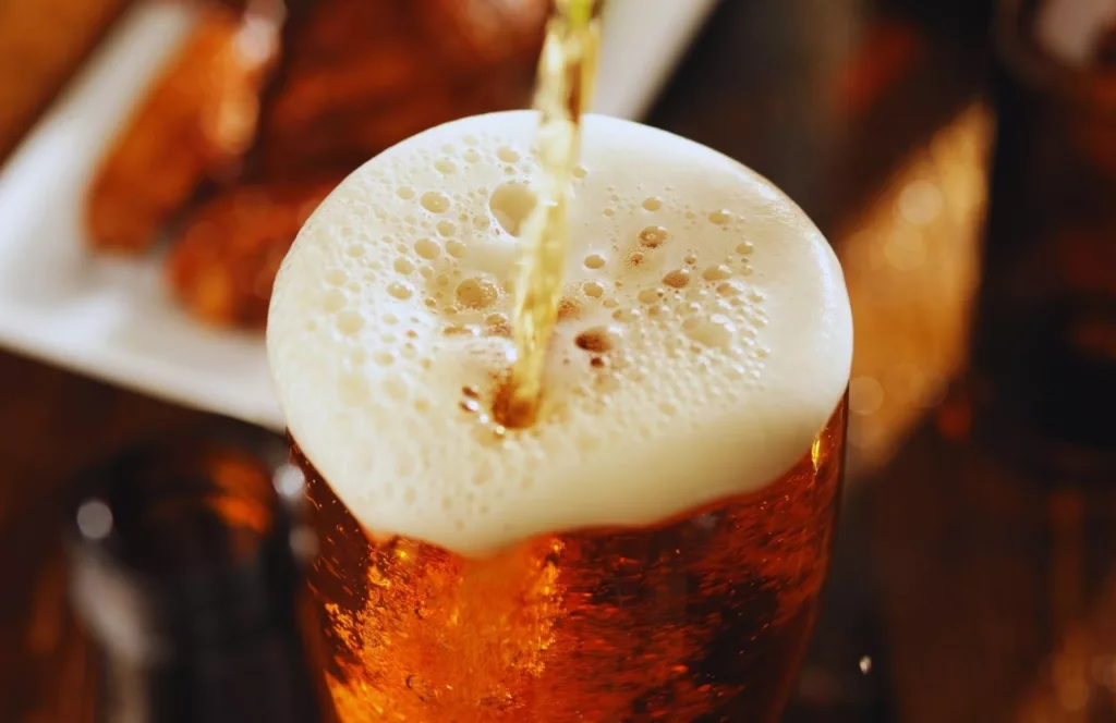 Beer being poured into a pint glass. Keep reading to find out ways to have fun in Gainesville.