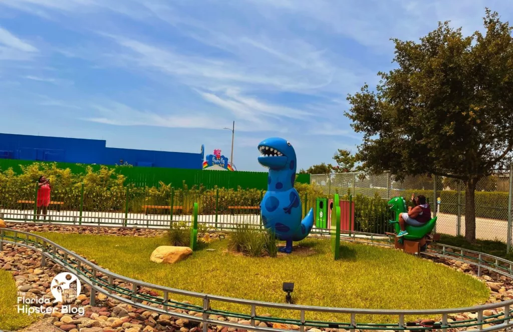 Peppa Pig Theme Park Florida Grampy Rabbit's Dinosaur Adventure with Blue Dinosaur. Keep reading to discover what to do at Peppa Pigs Theme Park.  