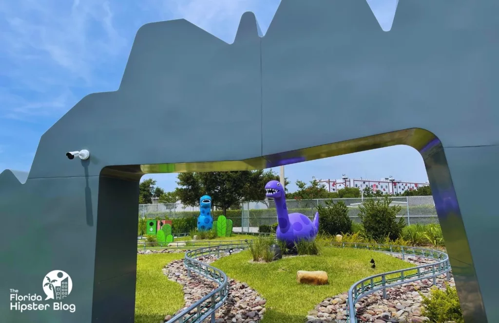 Peppa Pig Theme Park Florida Grampy Rabbit's Dinosaur Adventure with purple Dinosaur. Keep reading to find out everything you need to know about visiting Peppa Pig Theme Park. 