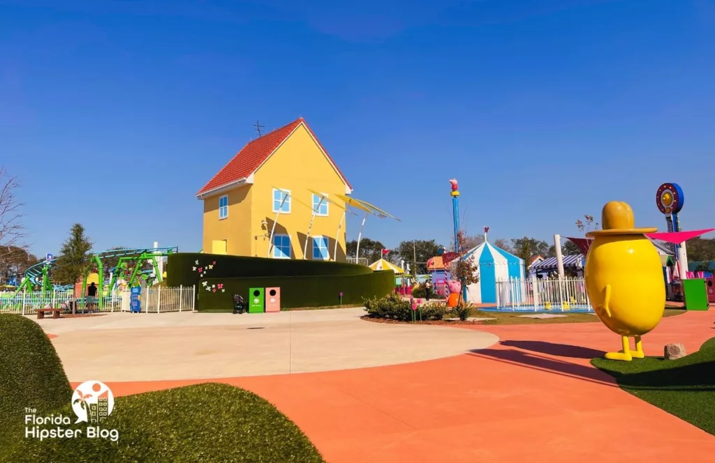 Peppa Pig Theme Park Florida House in front of Mr Potato. Keep reading to discover what to do at Peppa Pigs Theme Park.  