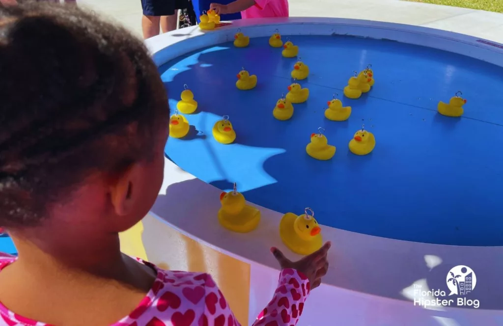 Peppa Pig Theme Park Florida Little Black Girl playing with rubber duckies