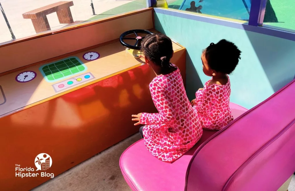 Peppa Pig Theme Park Florida Little Black Girls in the bus. Keep reading to learn more tips on how to visit Peppa Pig Theme Park. 