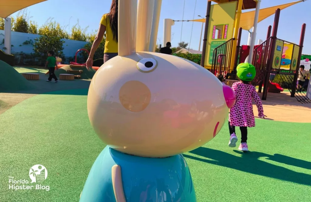 Peppa Pig Theme Park Florida Rabbit in playground. Keep reading to find out how to plan a day at Peppa Pig Theme Park.  