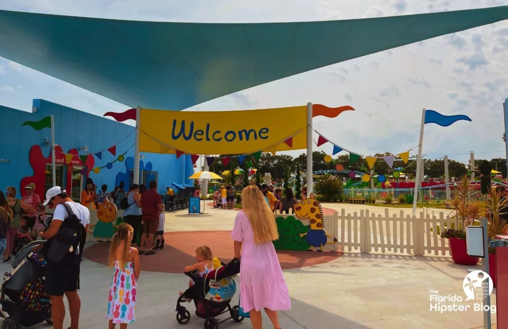 Peppa Pig Theme Park Florida Welcome Sign. Keep reading to find out how to plan a day at Peppa Pig Theme Park.  