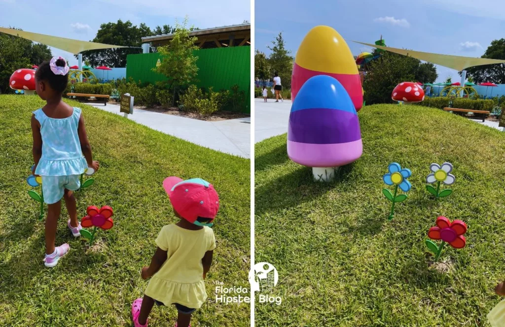 Peppa Pig Theme Park Florida with little black girls walking on the grass
