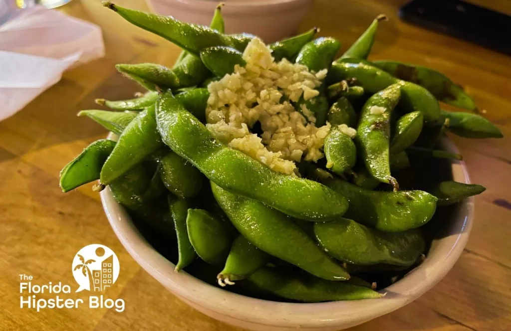 Teak Neighborhood Grill Restaurant in Orlando, Florida Edamame with Garlic. Keep reading to get the best wings in Orlando, Florida.