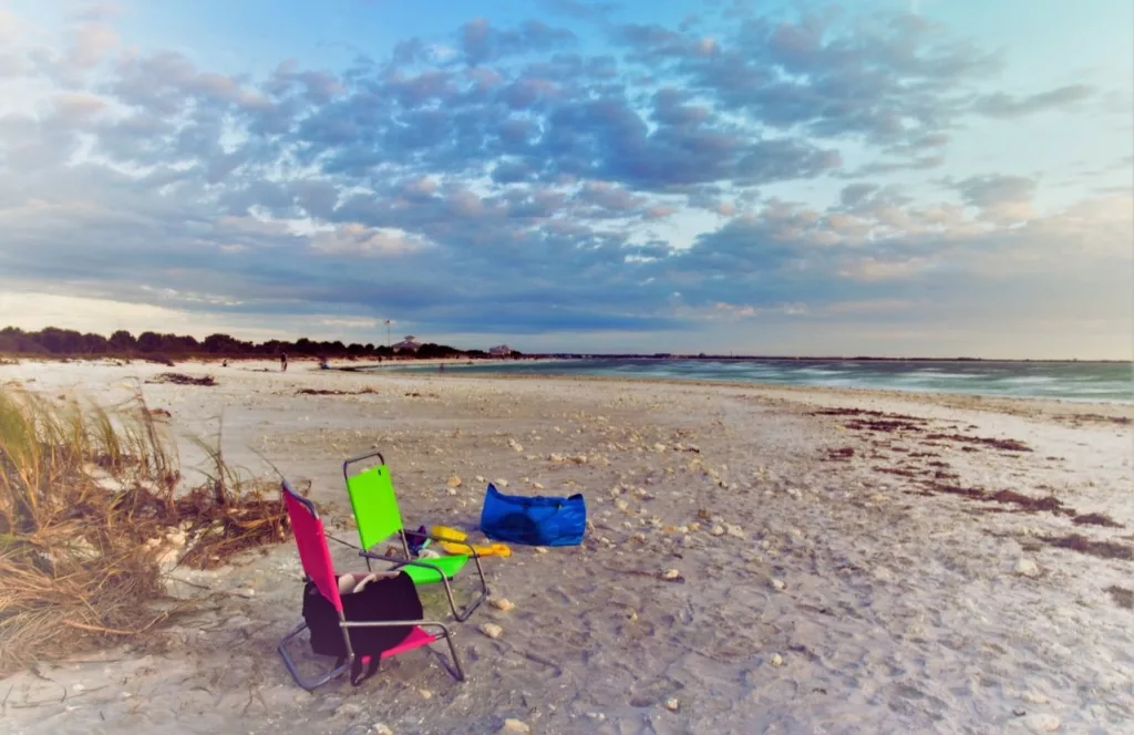 Beach chairs on the sand at Honeymoon Island State Park. One of the best West Central Florida beaches