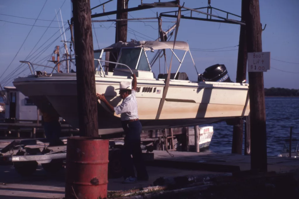 Boat on lift at Horseshoe Beach - Dixie County, Florida. Keep reading to get the best beaches near Gainesville, Florida.