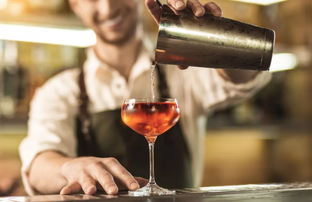 Bartender pouring a cocktail. Keep reading to find out more about the best events in Florida for the 4th of July. 