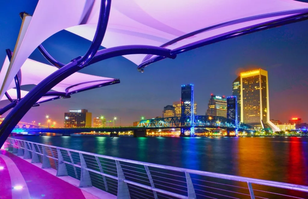 Riverside Neighborhood View lit up with colorful lights in the night. Keep reading to find out more about Margaritaville Beach Hotel Jacksonville.