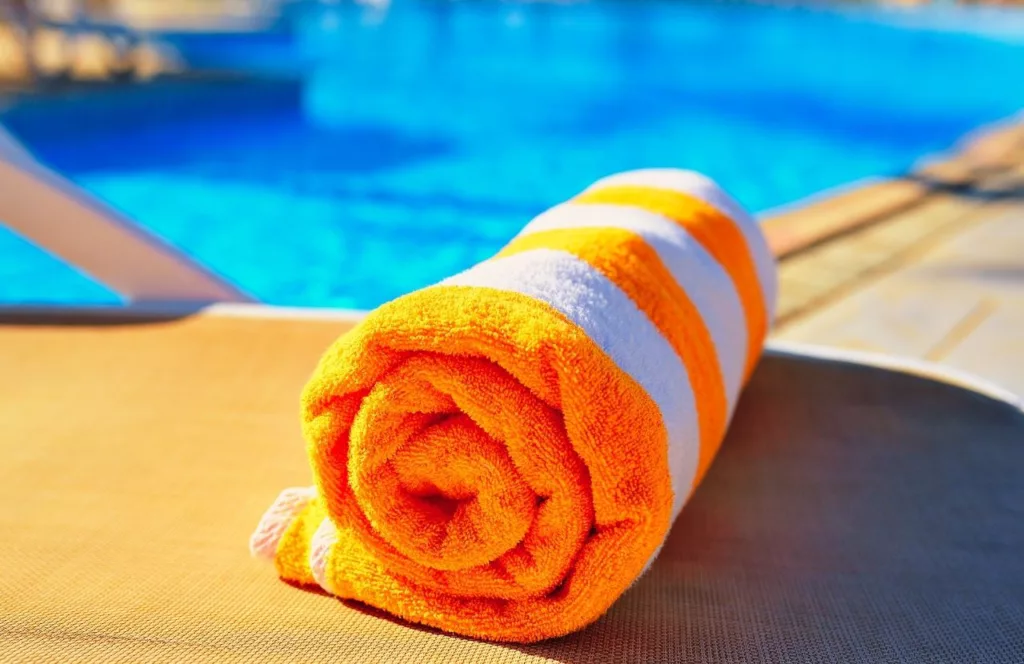 Beach towel by the pool. Keep reading learn more about The Avalon Club Hotel Clearwater.