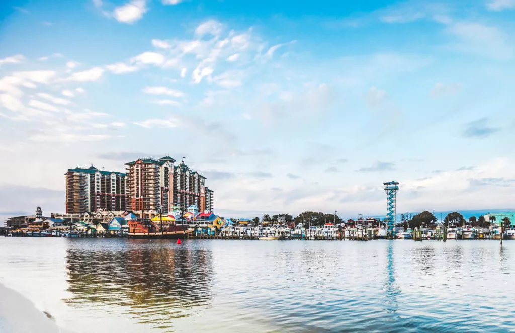 Crab Island with a colorful marina. Keep reading to learn about the Best Public Beaches in Destin, Florida.  