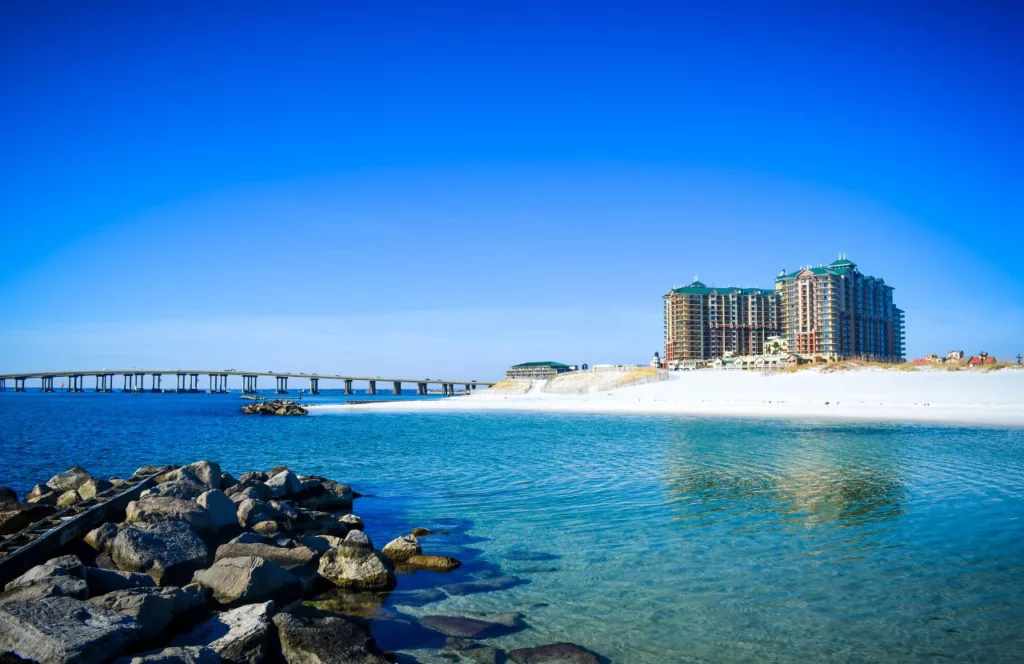 Crab Island on a sunny day with crystal clear waters and soft powder white sand. Keep reading to learn more about what public beaches in Destin are the best. 