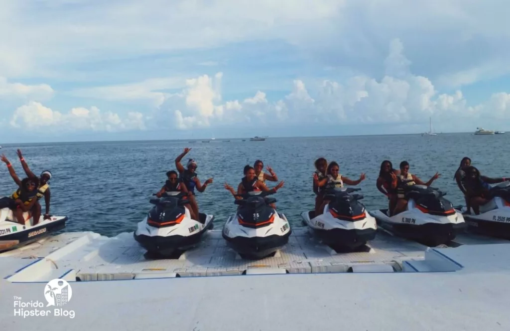 Key West, Florida girls trip on jet skis. Keep reading to get the best beaches in florida for bachelorette party.