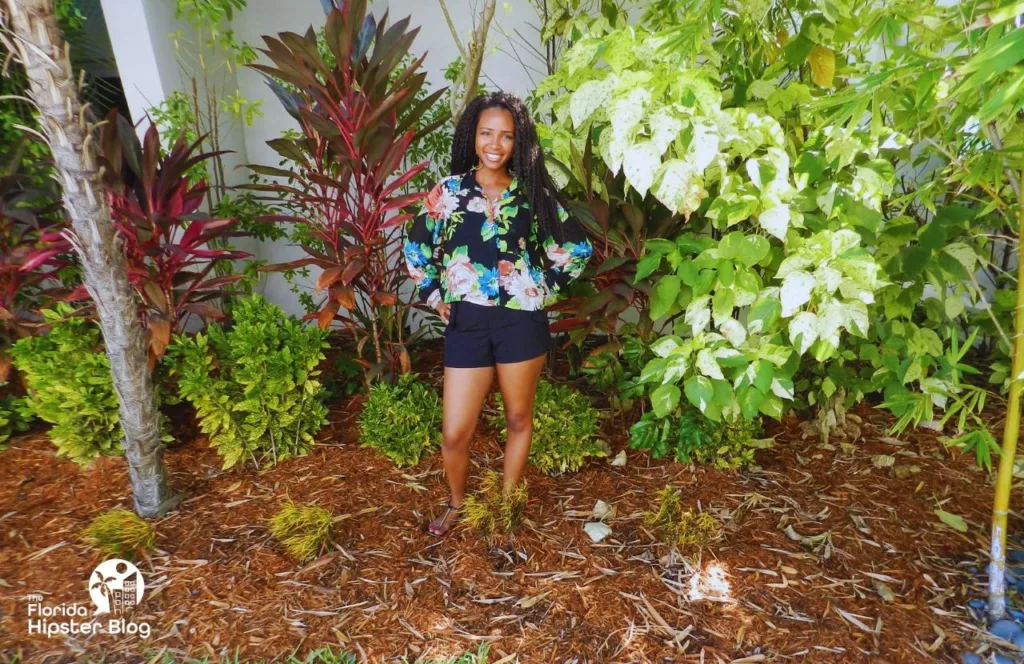Key West, Florida with NikkyJ in colorful plants. Keep reading learn about what to pack for Florida and how to create the best Florida Packing List 