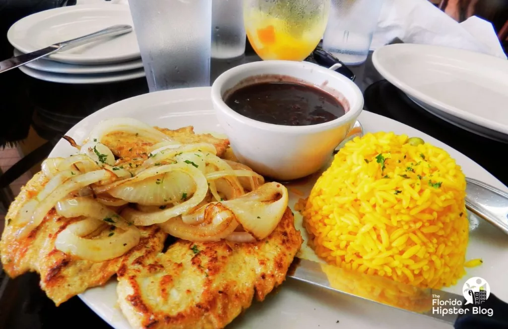 Rumba Cuban Cafe in Naples, Florida Grilled Chicken with Onions yellow rice and black beans. Keep reading to find out all you need to know about brunch in Naples.